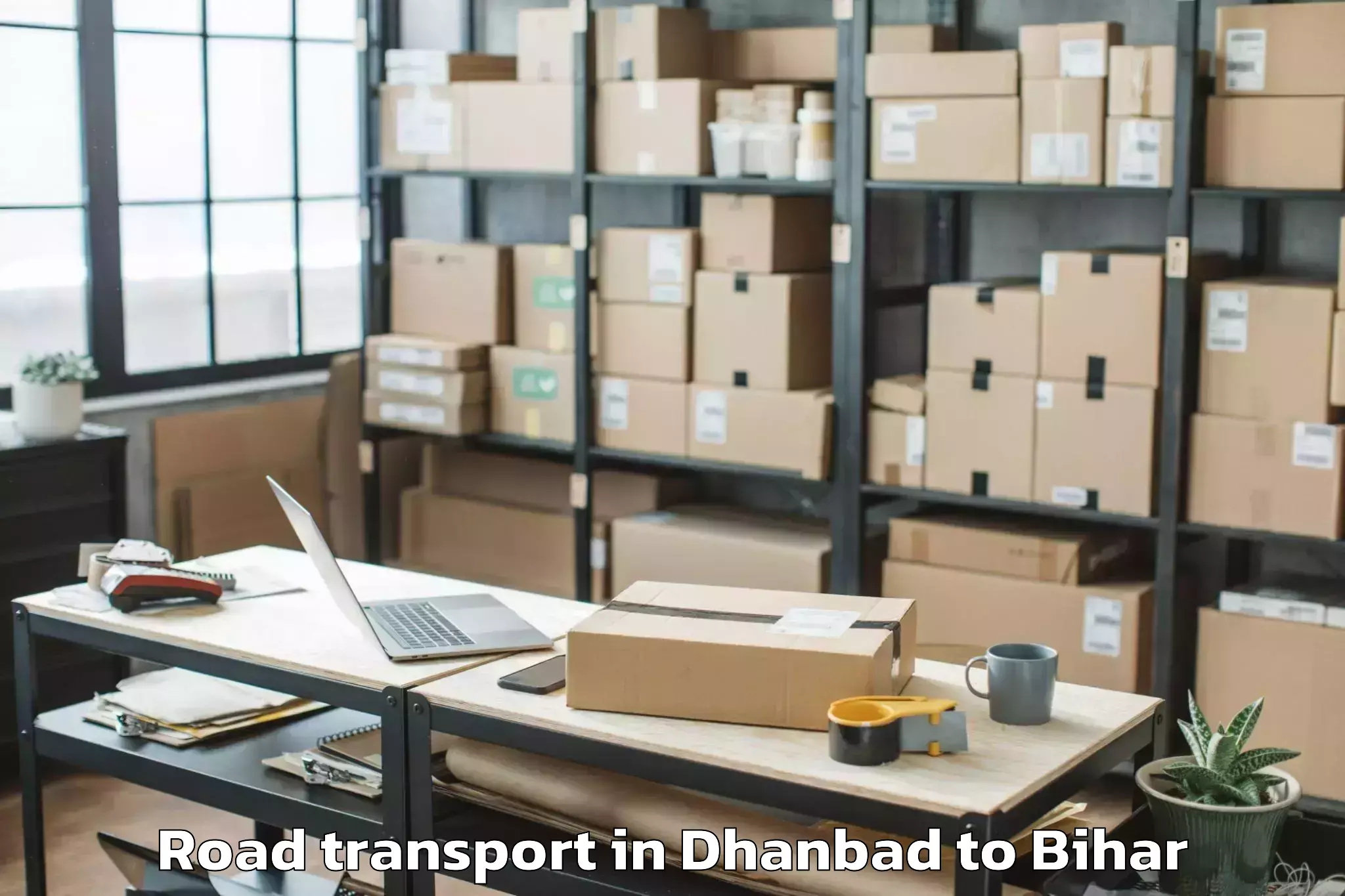 Easy Dhanbad to Wazirganj Road Transport Booking